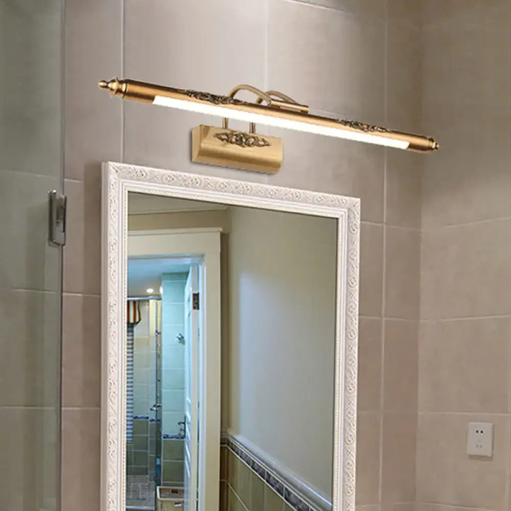 Minimalist gold brass led vanity mirror light with wide fixture width and bulb base featuring ornate filigree accents