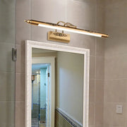 Minimalist gold brass led vanity mirror light with wide fixture width and bulb base featuring ornate filigree accents