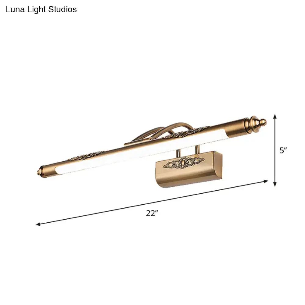 Antique brass-finished wall-mounted vanity light with ornate floral detailing and wide fixture width for bulb base compatibility