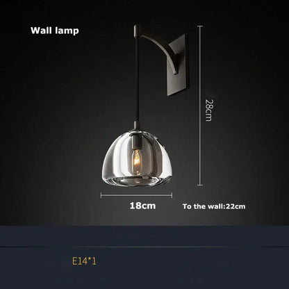 A sleek minimalist gold crystal chandelier lighting with clear glass dome and matte black bracket for dining room decorbites k9 crystal