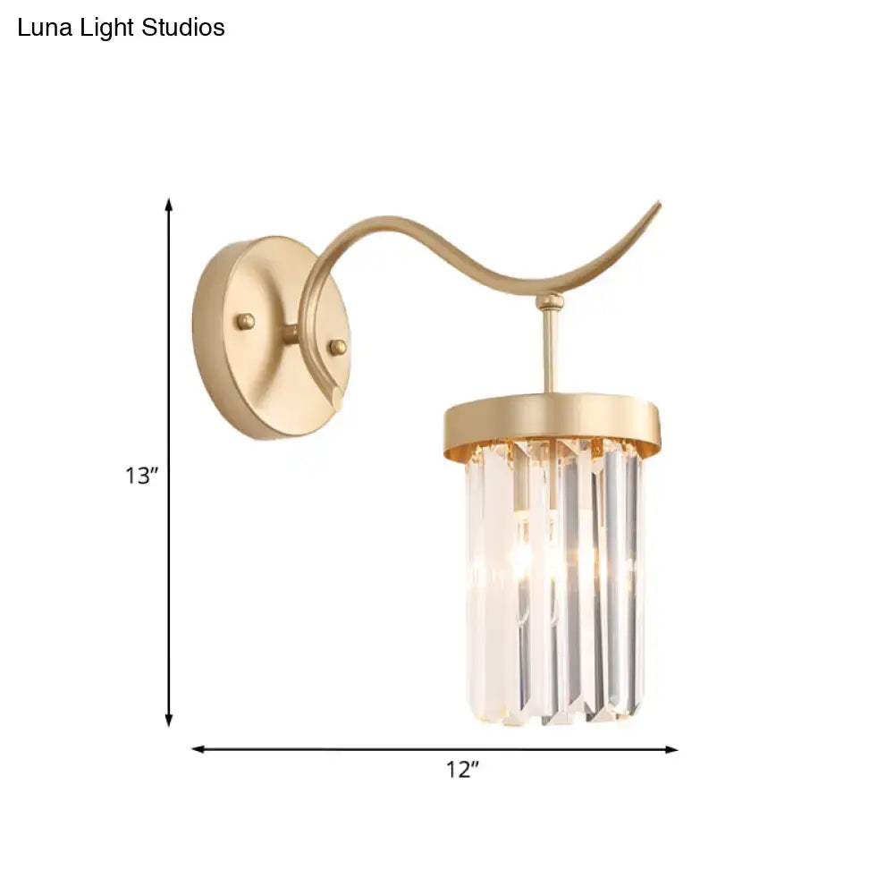 Minimalist gold wall mount light featuring a curved arm with vertical crystal prisms for bedroom use