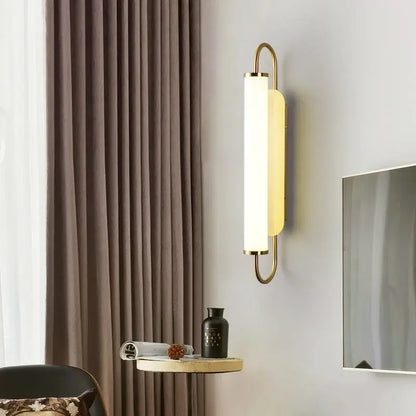 Minimalist gold elegant wall sconce with a sleek metal frame and frosted glass diffuser for bedroom decorbites elegant wall use