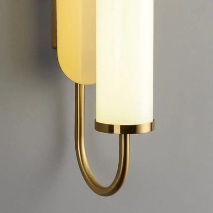 Minimalist gold elegant wall sconce with curved brass arm and frosted glass shades perfect for bedroom decorbites elegant wall