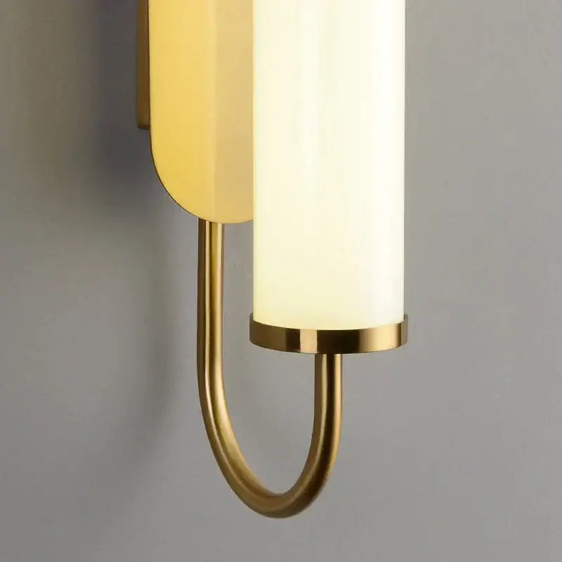 Minimalist gold elegant wall sconce with curved brass arm and frosted glass shades perfect for bedroom decorbites elegant wall