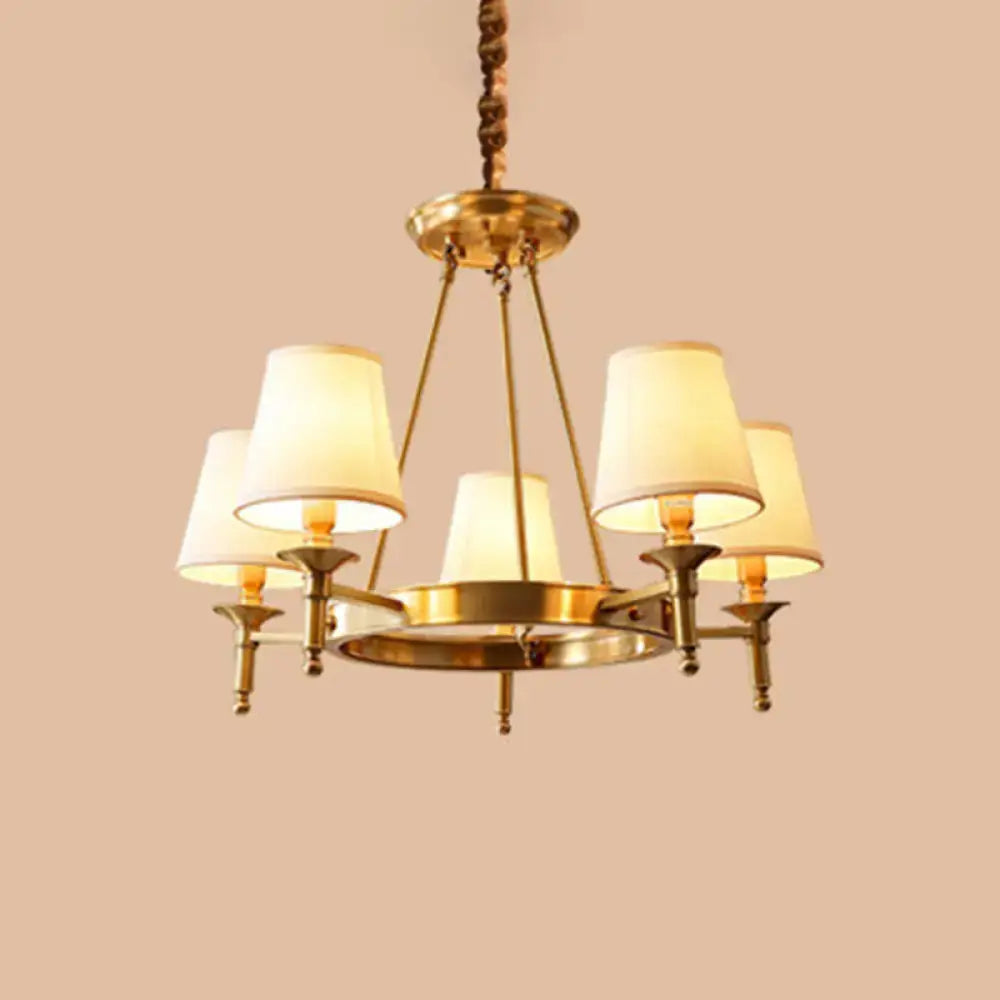 Minimalist gold fabric bedroom conical ceiling chandelier with brass finish and five cream-colored fabric shades