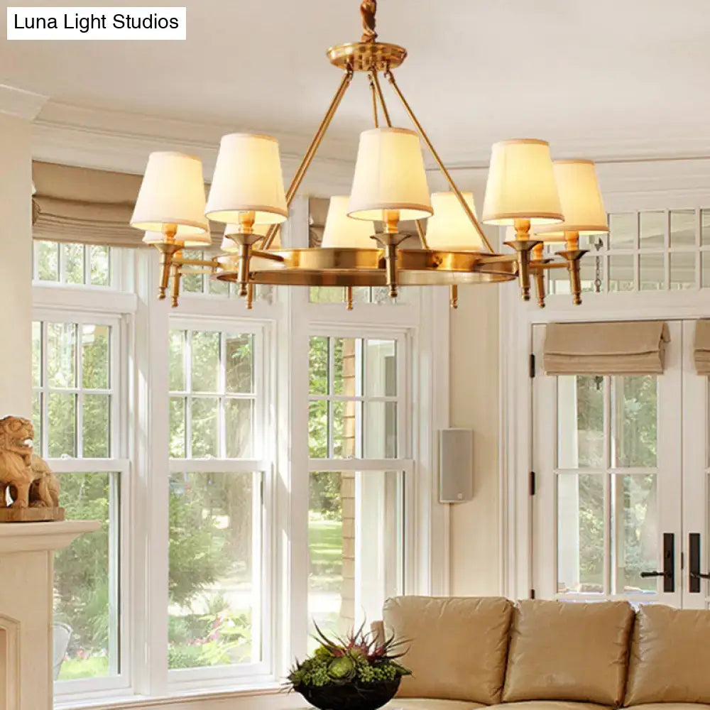 Minimalist gold fabric bedroom conical ceiling chandelier with six cream-colored fabric shades and brass frame