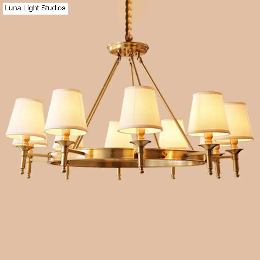 Minimalist gold fabric bedroom conical ceiling chandelier with six cream fabric shades and twisted brass chain