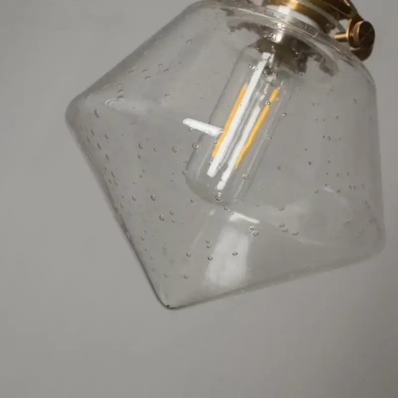Clear glass minimalist gold faceted bubble led hanging light with brass fixture and filament bulb for dining room