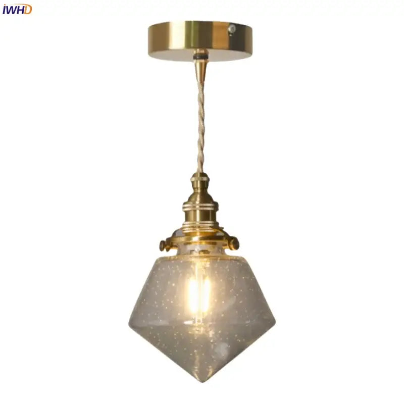 Minimalist gold led hanging light with faceted speckled bubble glass shade and twisted cord suspension for dining room
