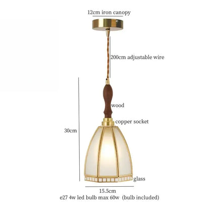 A warm-toned minimalist gold faceted bubble glass led hanging light with brass iron canopy and wooden handle for dining
