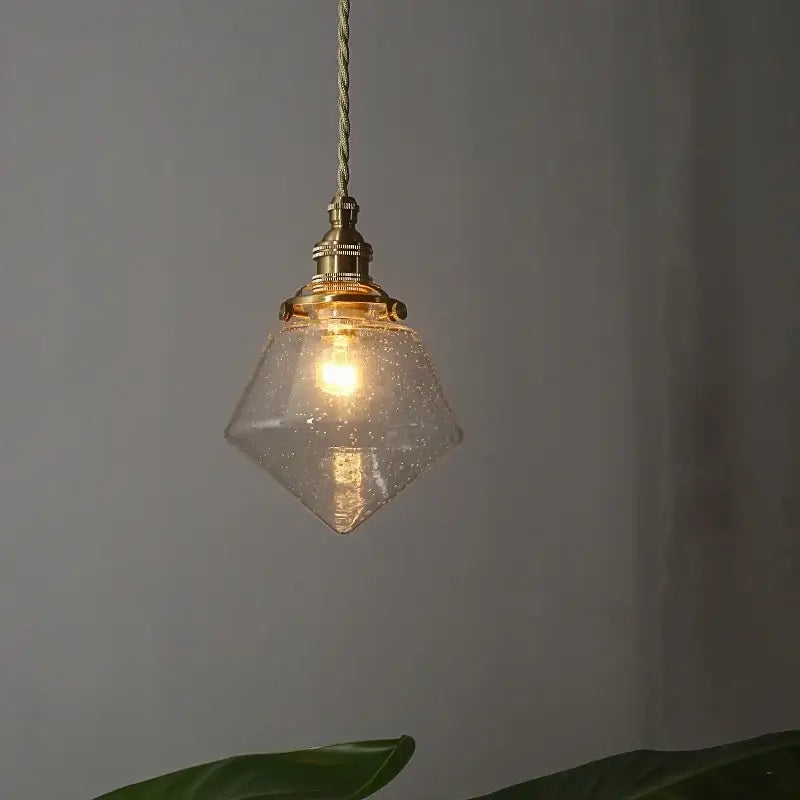 Minimalist gold faceted bubble glass led hanging light with brass fixture and twisted cord for dining room use