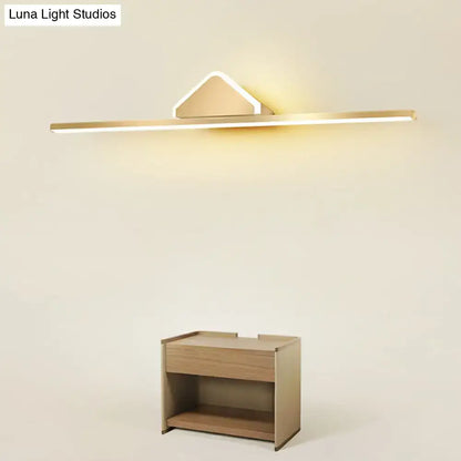 Minimalist gold finish led vanity light with acrylic linear led and angular triangular accent for bathroom walls