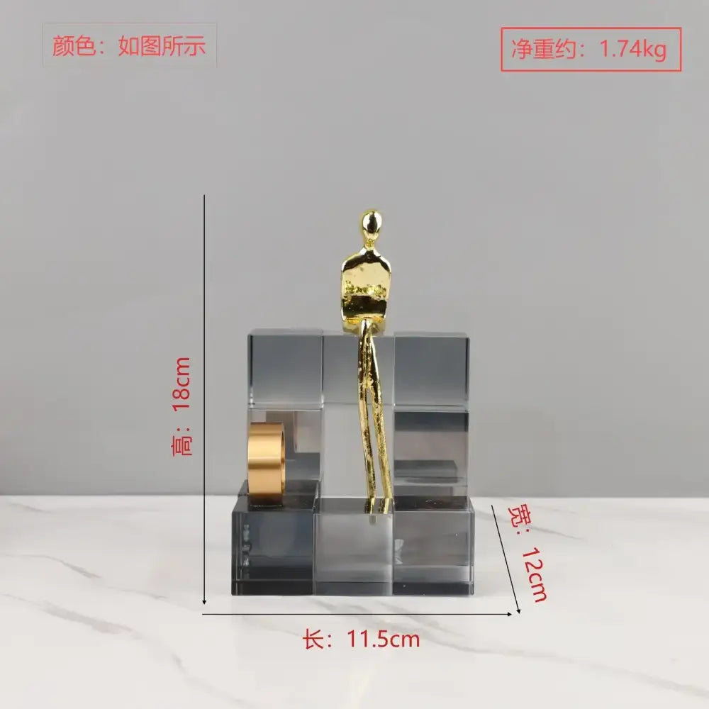 A sleek minimalist gold figurine on transparent geometric stair crystal blocks for living room decorbites decor