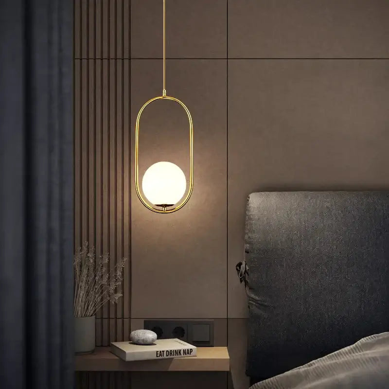 Minimalist gold glass ball led chandelier with gold-toned oval pendant and frosted glass globe for dining room decorbites glass ball