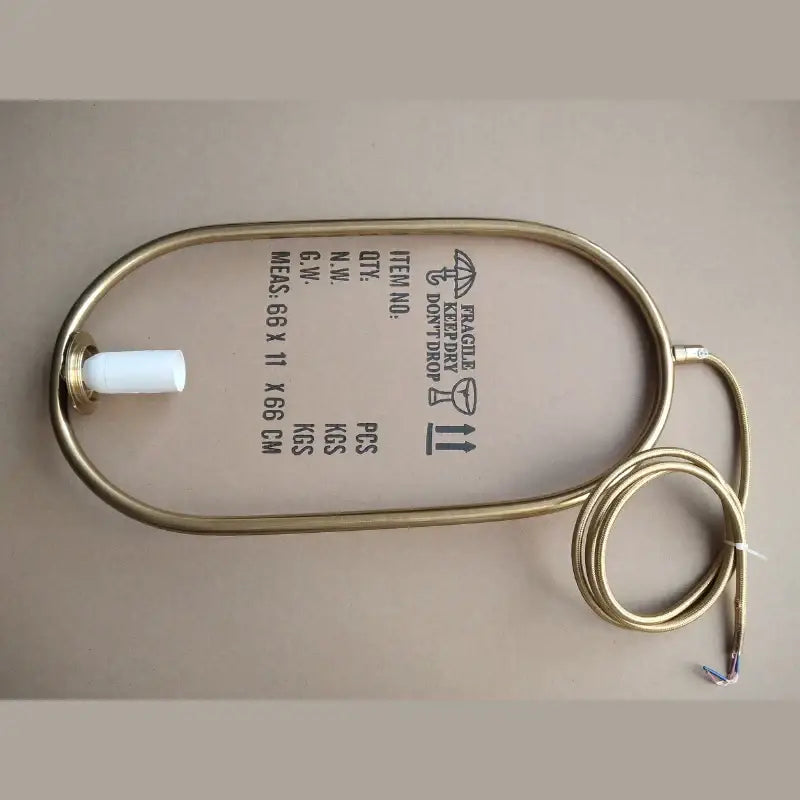 Gold-colored metal heating cable with white connector and exposed wire ends for decorbites glass ball led chandelier