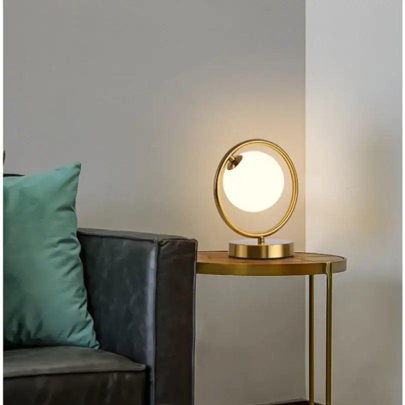 Minimalist gold-toned table lamp with frosted glass ball led and metal frame for bedroom decorbites decor