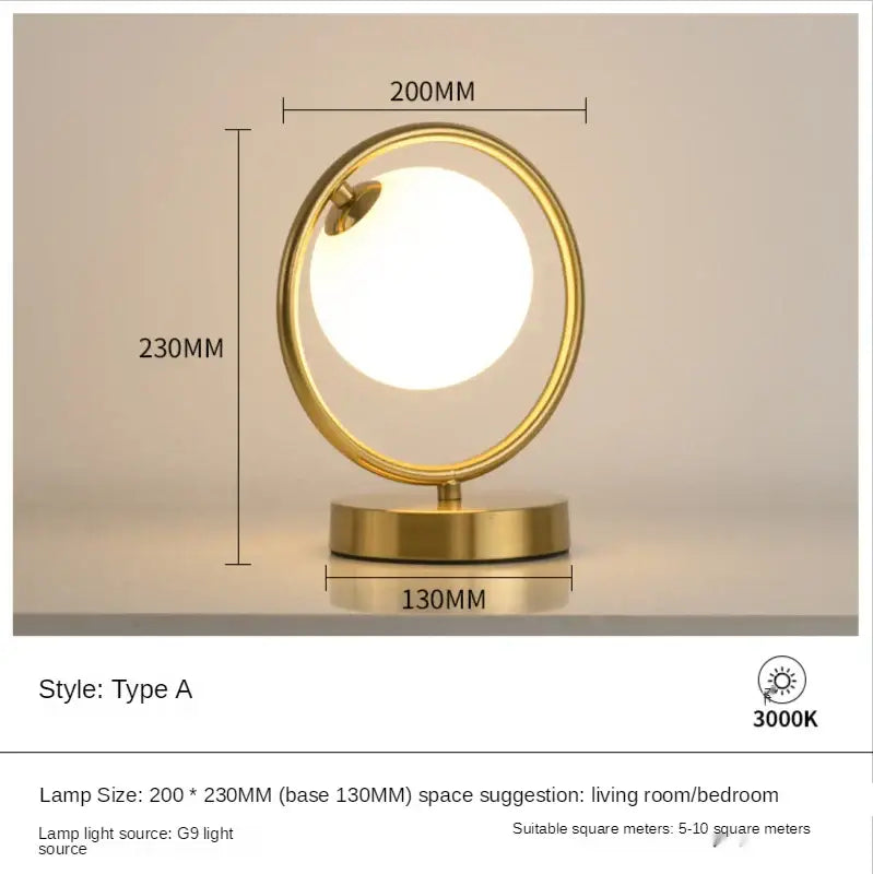 Minimalist gold-toned table lamp with glass ball led bulb encased in metallic ring for bedroom decorbites decor