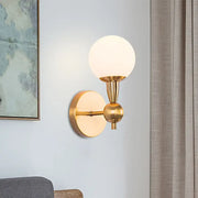 Minimalist gold wall sconce with hand blown frosted glass globe shade for elegant bedroom sconce light
