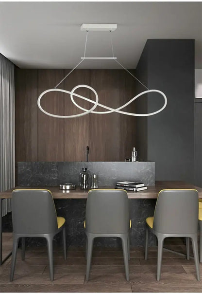 Minimalist gold infinity led strip island light with sleek white metal dining room pendant above table