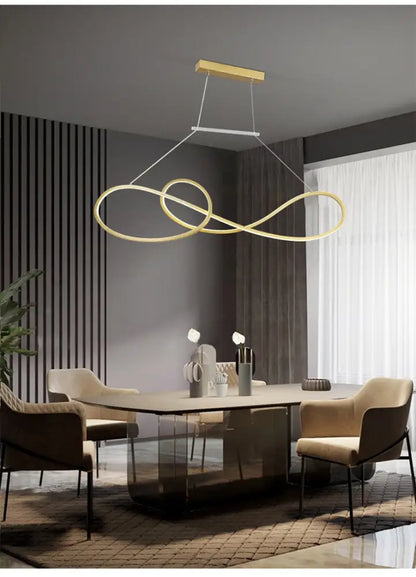 Gold-toned minimalist metal dining infinity led strip island light with sleek modern design above dining table
