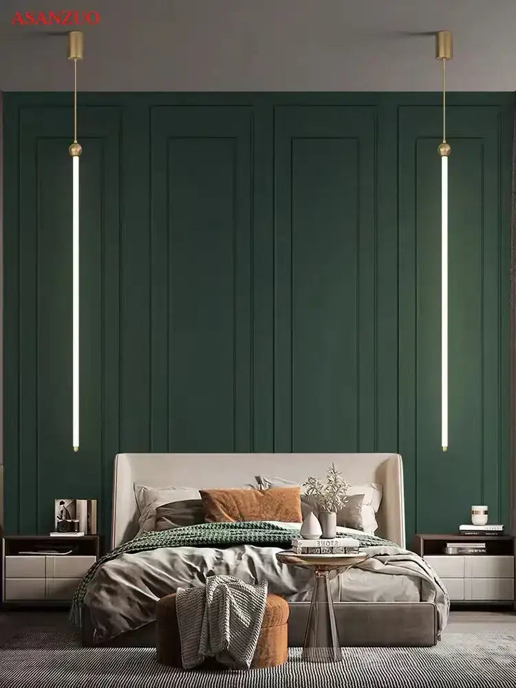 Minimalist gold led strip pendant light with linear design against deep green paneled wall for dining room decorbites pendant light