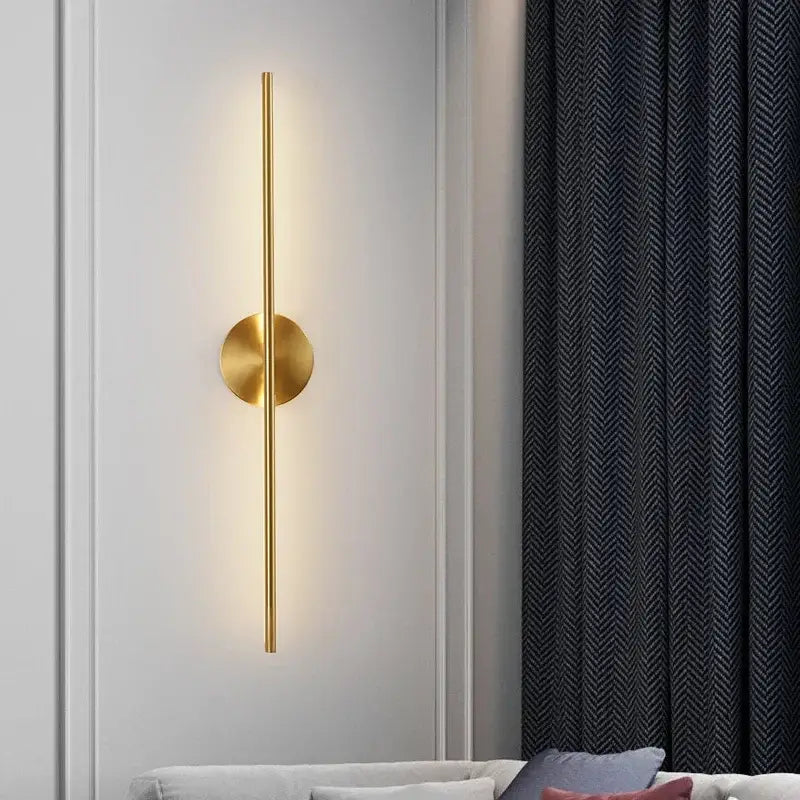 Minimalist gold linear led wall sconce lamps featuring a sleek vertical rod and circular base for modern lighting