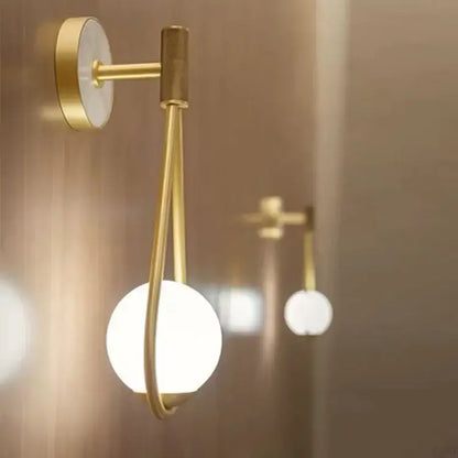 Minimalist gold marble glass ball wall lamp featuring a circular marble backplate and frosted glass globe shade for decorbites wall lamp