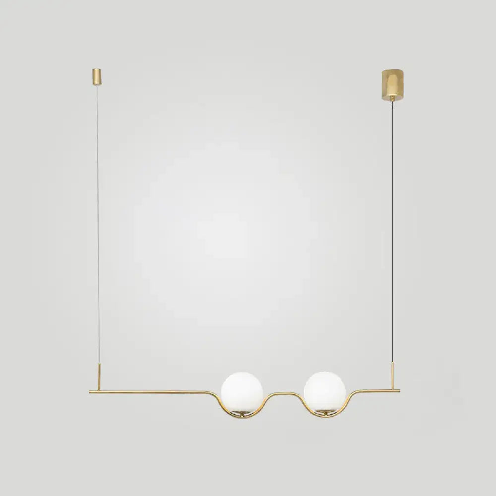 Minimalist gold metal island pendant ceiling light with two white glass bulbs for dining table lighting