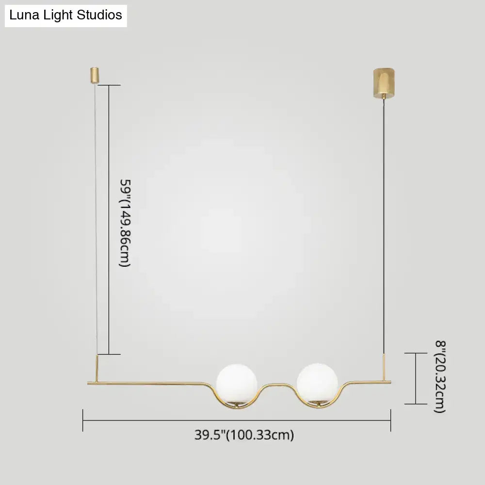 Minimalist gold metal island pendant ceiling light with two white glass spherical shades for dining table use