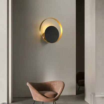 Minimalist gold nordic led wall sconce with gold-toned circular frame and black central disc for bedroom lighting decorbites gold nordic
