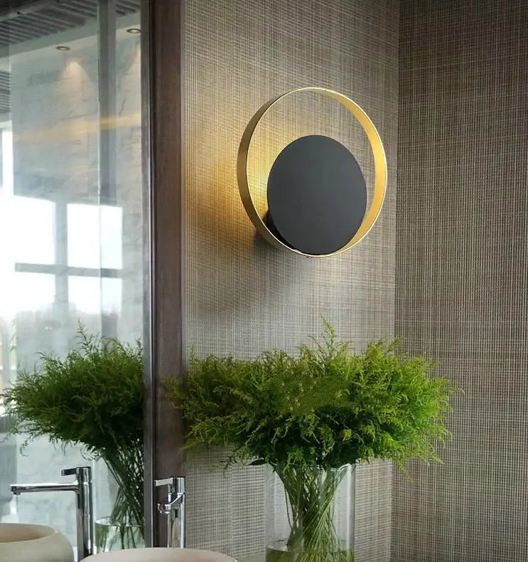 Minimalist gold-tonic nordic led wall sconce with black central disc for bedroom lighting by decorbites gold nordic