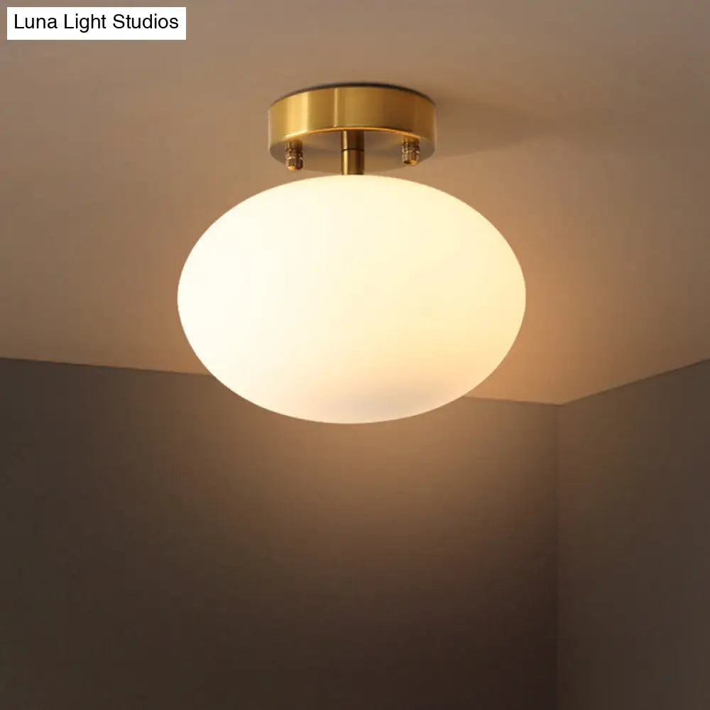 Minimalist Gold Oval Semi Flush Ceiling Light - 1-Light Cream Glass Lamp for Bedroom