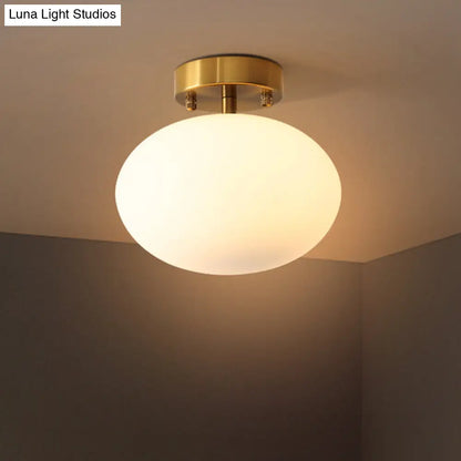 Minimalist Gold Oval Semi Flush Ceiling Light - 1-Light Cream Glass Lamp for Bedroom