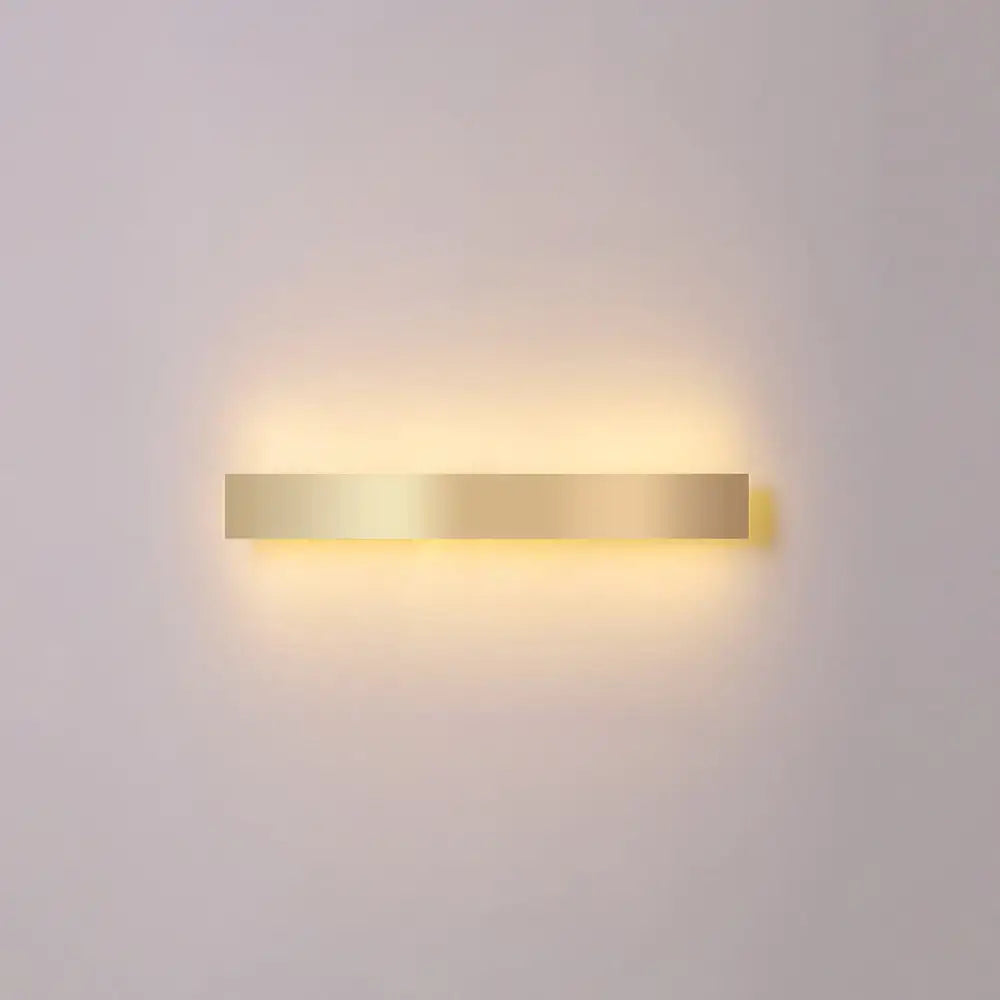 Minimalist gold plated rectangular led wall sconce with warm soft glow for living room and bar lighting