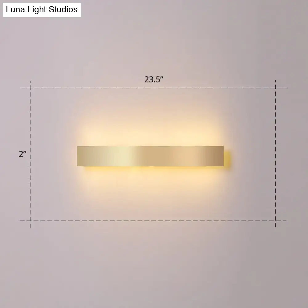 Minimalist gold plated led wall sconce with a rectangular design and warm ambient lighting for living room or bar