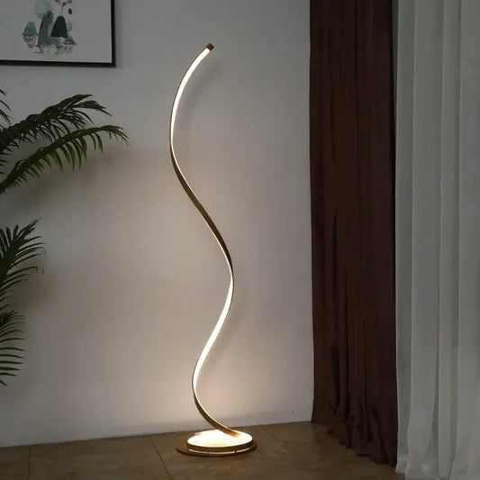 A minimalist standing lamp with a sleek gold metallic frame and warm led light strip for living room use