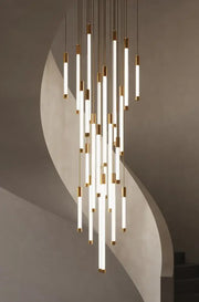 Minimalist gold and white elegant led chandelier featuring slender glowing tubes capped in polished gold for living room