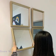 Minimalist rectangular mirror wall decor with gold-framed golden border and subtle metallic sheen for living room use