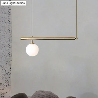 DecorBites™ minimalist brass pendant light with frosted glass globe for modern dining room lighting