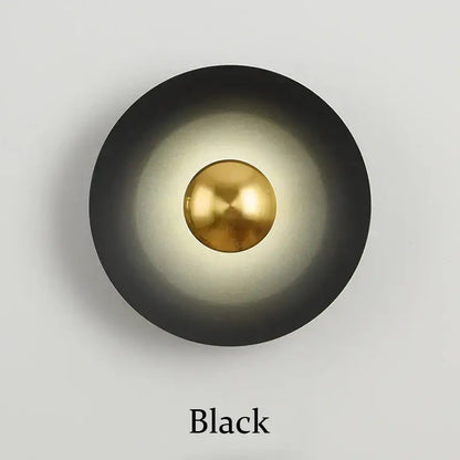 Minimalist black matte wall lamp with polished brass accent for bedroom ambient light by decorbites golden macaroon led