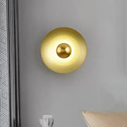 Minimalist golden macaroon led wall lamp with gold-toned spherical design providing warm ambient lighting for decorbites