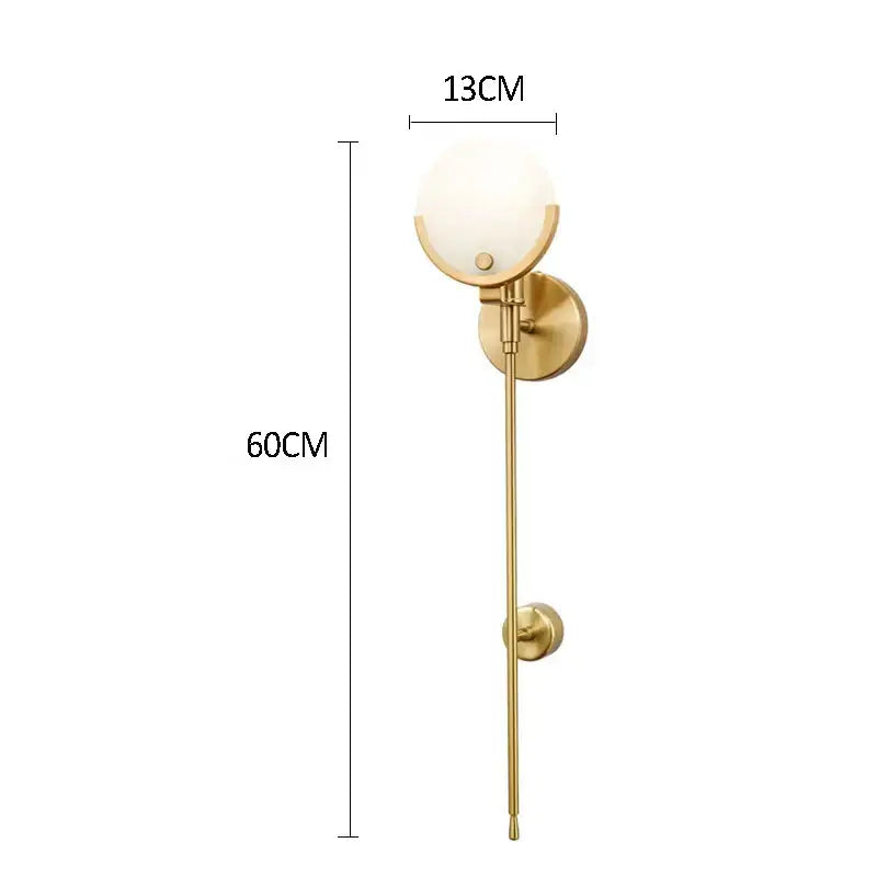 Minimalist golden marble wall lamp with gold-toned frosted glass globe and slender rod for bedroom and living room decorbites wall lamp