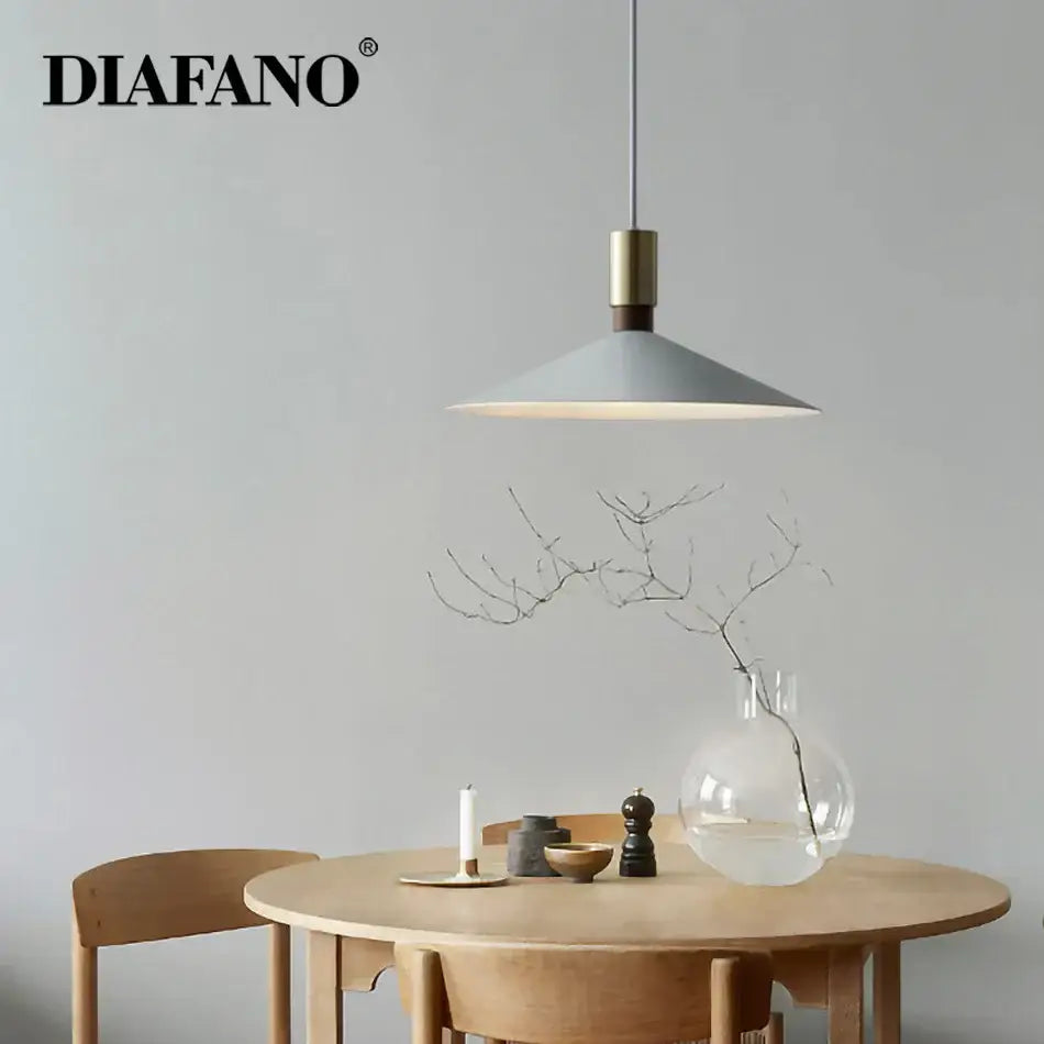 Minimalist gray and brass decorbites dimming pendant light with sleek modern design for dining room decor