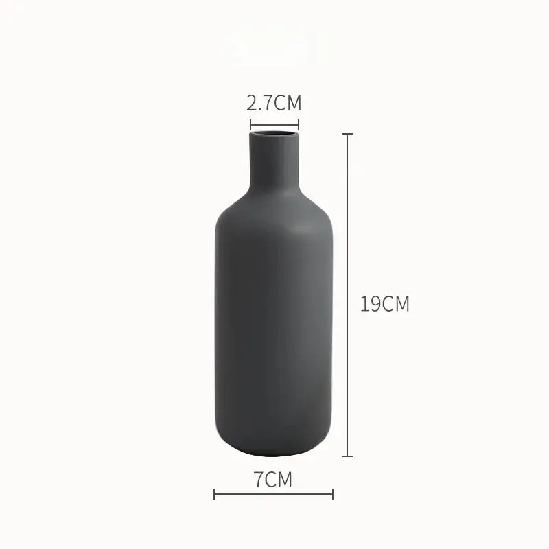 A sleek matte black ceramic vase with slender neck and rounded body from decorbites colorful ceramic collection