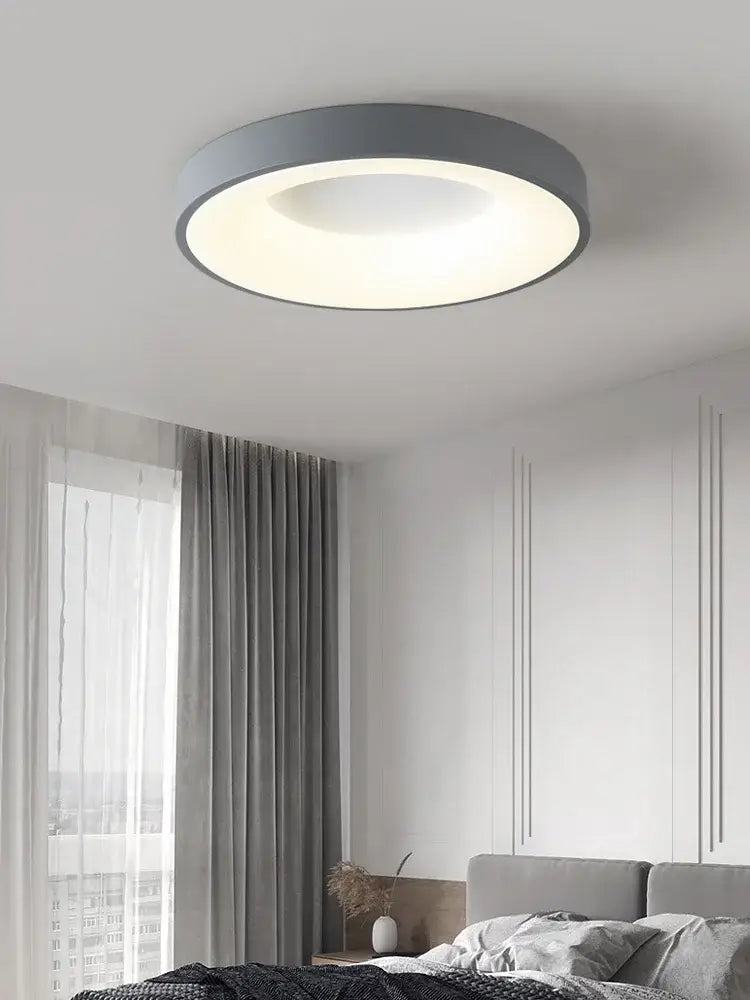 Minimalist gray round dining room ceiling lamp with sleek gray outer ring and soft white illuminated center ceiling lamp