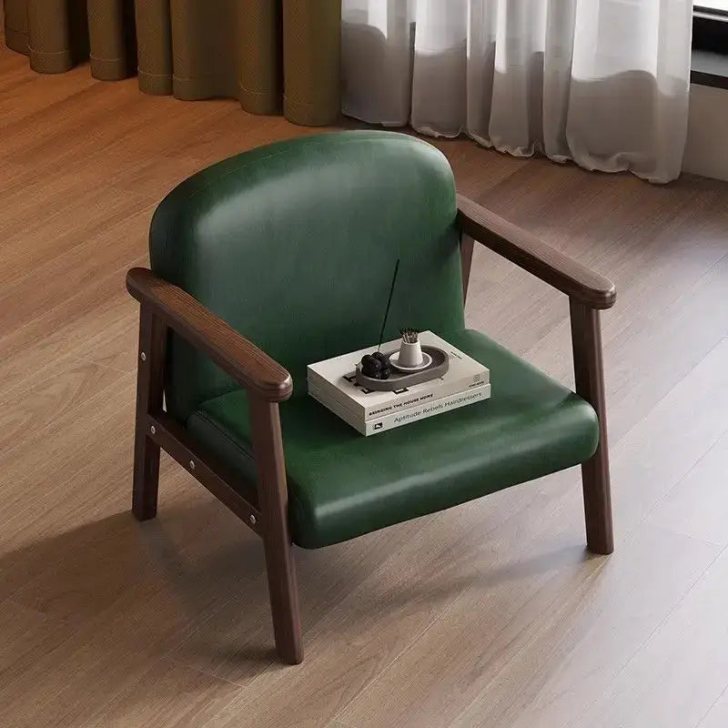 Minimalist kids wooden chair in dark green leather with wooden arms and legs designed for kids bedroom set