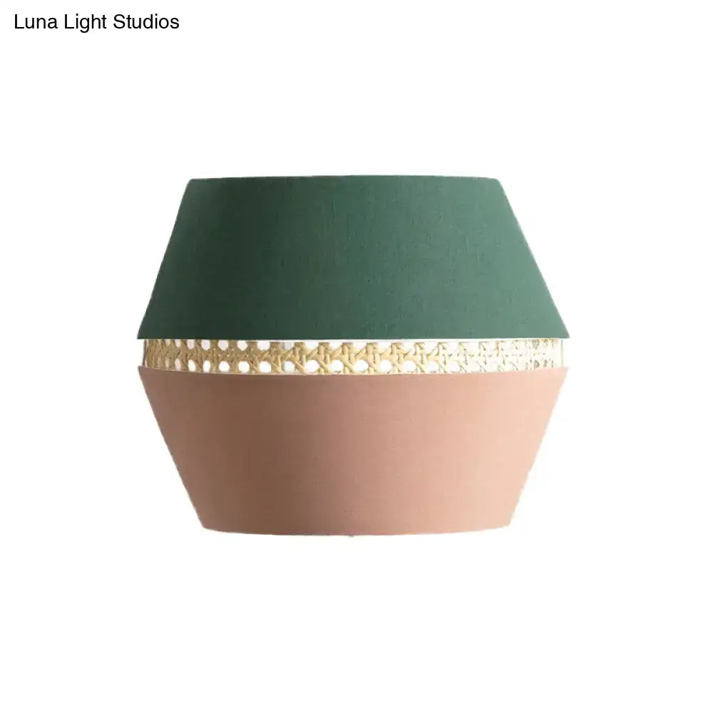 Minimalist green and terracotta rattan wall mount light with matte forest green and blush pink lampshade and gold band wall lamp direct wired electric