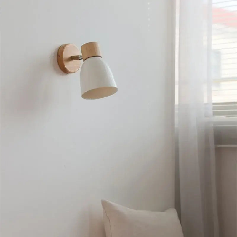 Minimalist wall lamp with natural iron wood base and matte white conical shade for bedroom decorbites iron wood led lighting