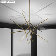Minimalist led pearl black and gold starburst chandelier with gold-toned geometric rods for dining room lighting