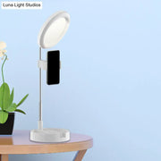 Minimalist white led ring light with sleek adjustable stand and phone holder powered by usb power source for bedroom use
